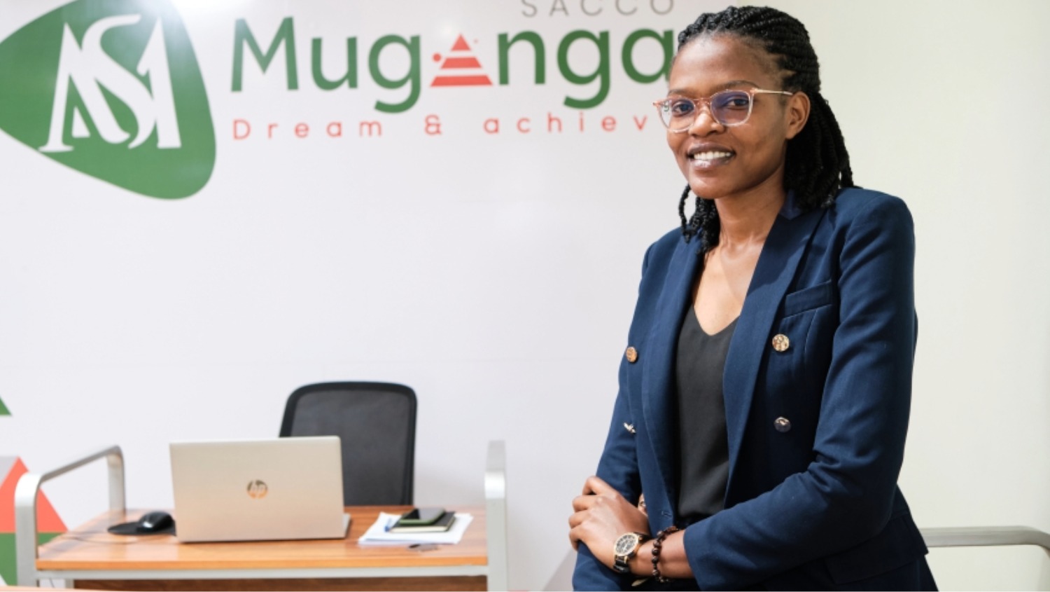 An african woman in suit sitting in an office