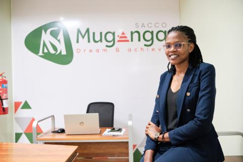 An african woman in suit sitting in an office